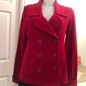 Norma Kamala red double breasted jacket . Slanted pockets on both sides .